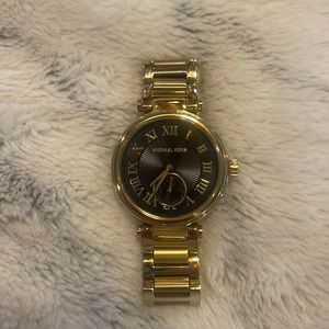 Black and gold Michael Kors watch